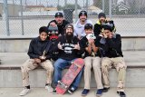 Tim Welsh (center with skateboard) celebrates winners of a skateboard competition held to benefit foster kids. Winners include Jonathan Contreras, Mark Urbieta, Ethan Ebrahim, fellow owner Tim Taylor and judges Tylorr Rodriguez and John Silva.